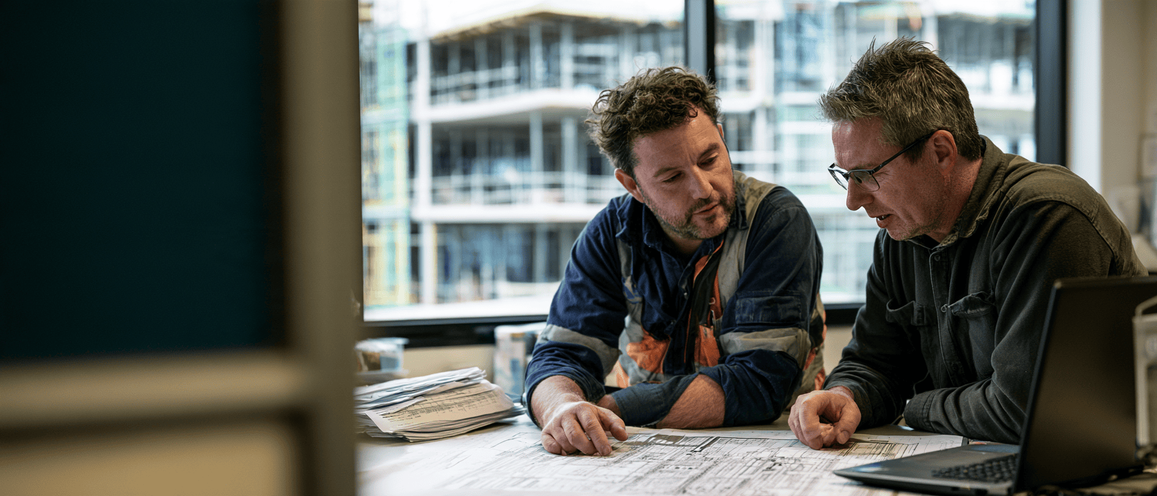 Illustrative construction professionals reviewing project plans